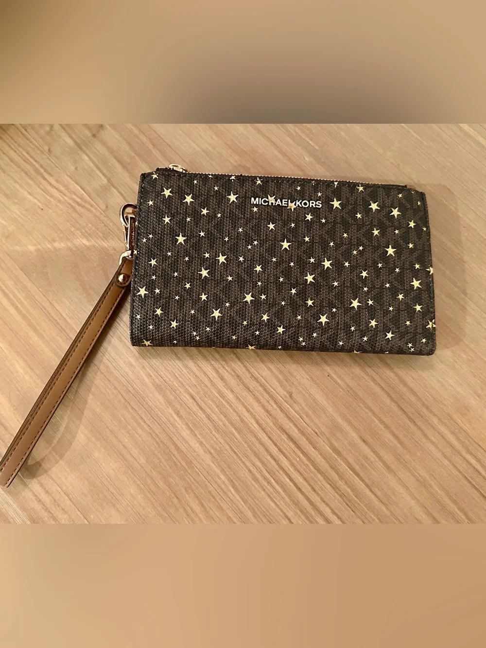 Michael Kors Black Star Print Wristlet with Tan Strap